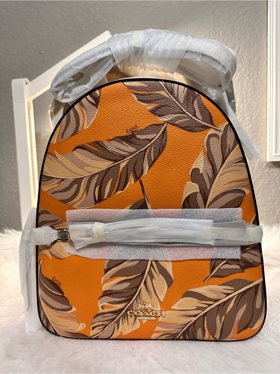 brown and orange coach backpack Warner In Signature Canvas Refined pebble leather Inside zip cell phone and multifunction pockets Inside tech sleeve Drawstring and snap closures recycled polyester lining Top handle with 3 1/4 drop Outside zip and flap pockets Adjustable shoulder straps Luggage sleeve Fits a 15 laptop 11 1/4 (L) x 18 (H) x 6 1/2 (W) Style No. Coach backpack 70% off for